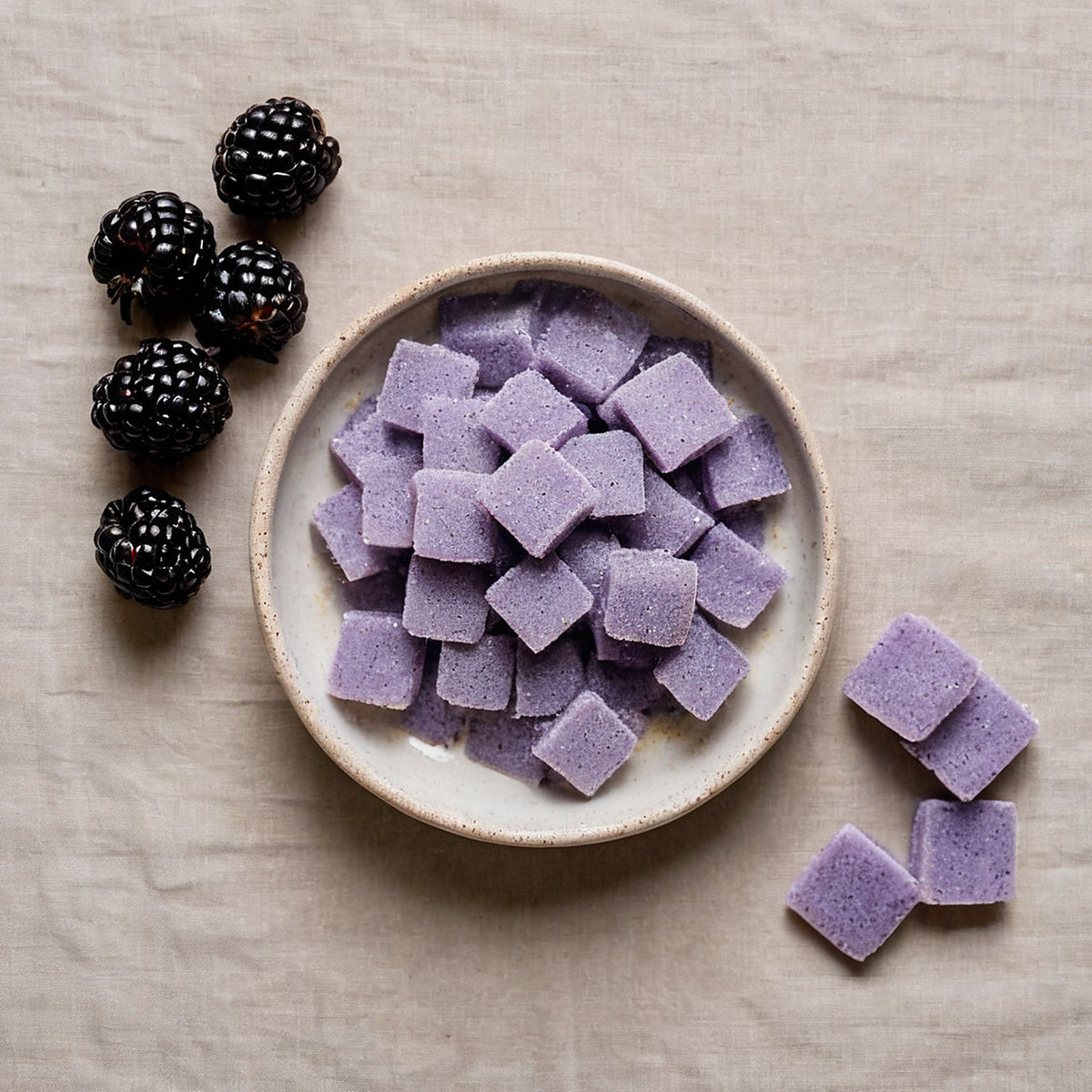 Bowl of lavender even recovery gummies from above